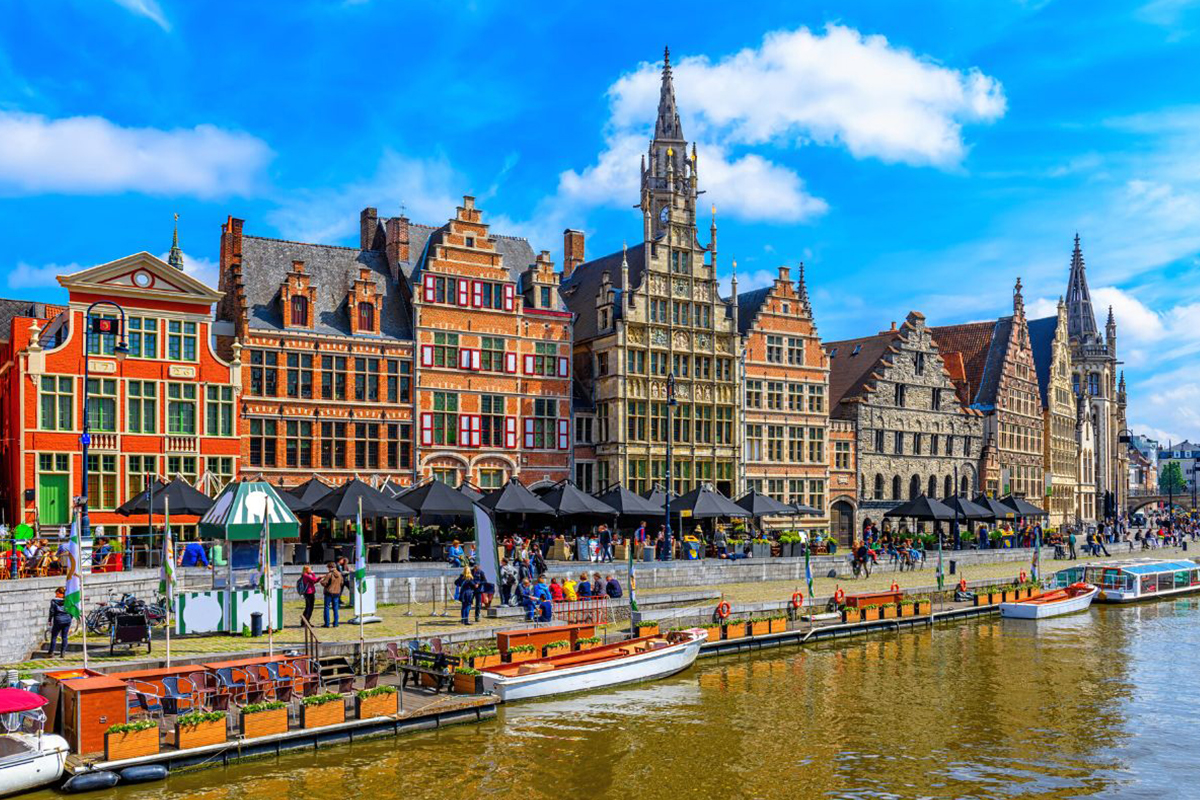 a body of water with boats and buildings along it