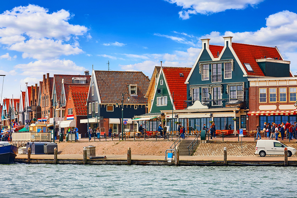 a group of colorful buildings next to a body of water